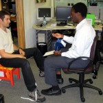 Photo : Ollie measuring Ignacio's stereoacuity with the Frisby test